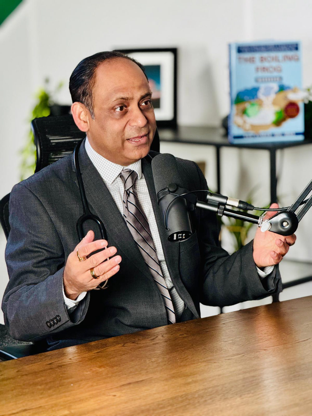 Dr Ash Kumar recording the Transforming Stress podcast